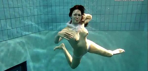  Brunette big tits teen Andrea swimming in the pool